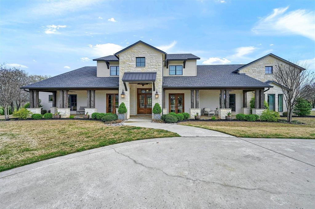 8301 Stephens Ranch Road Pilot Point, TX 76258 - Photo 2 of 40 a front view of a house with a yard