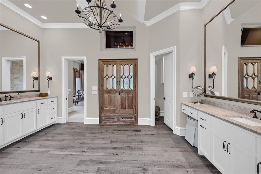 8301 Stephens Ranch Road Pilot Point, TX 76258 - Photo 23 of 40 a spacious bathroom with a granite countertop sink mirror and