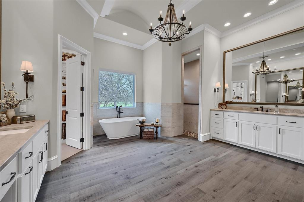 8301 Stephens Ranch Road Pilot Point, TX 76258 - Photo 24 of 40 a large white kitchen with a refrigerator a sink dishwasher a dining table and chairs