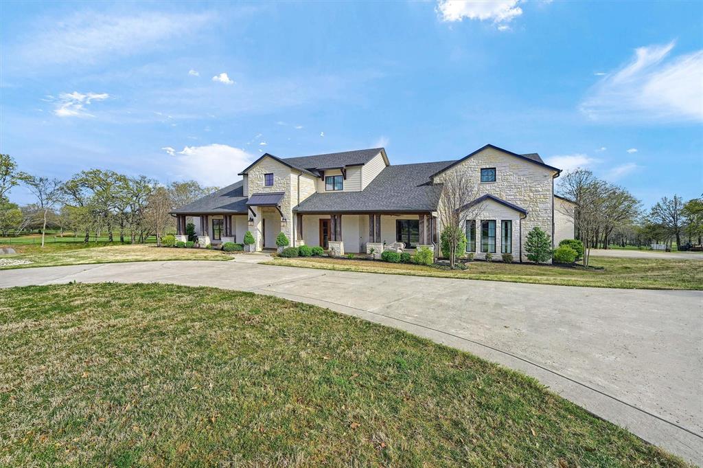 8301 Stephens Ranch Road Pilot Point, TX 76258 - Photo 3 of 40 a front view of a house with a yard