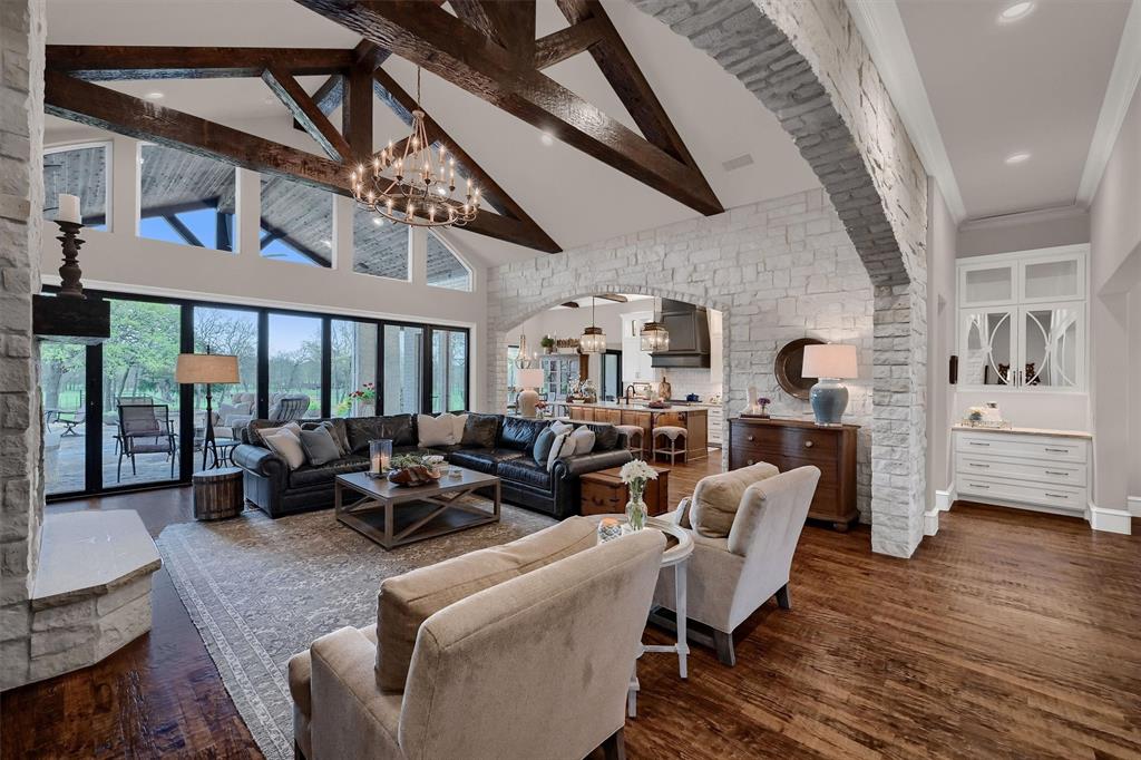 8301 Stephens Ranch Road Pilot Point, TX 76258 - Photo 9 of 40 a living room with furniture floor to ceiling window and wooden floor