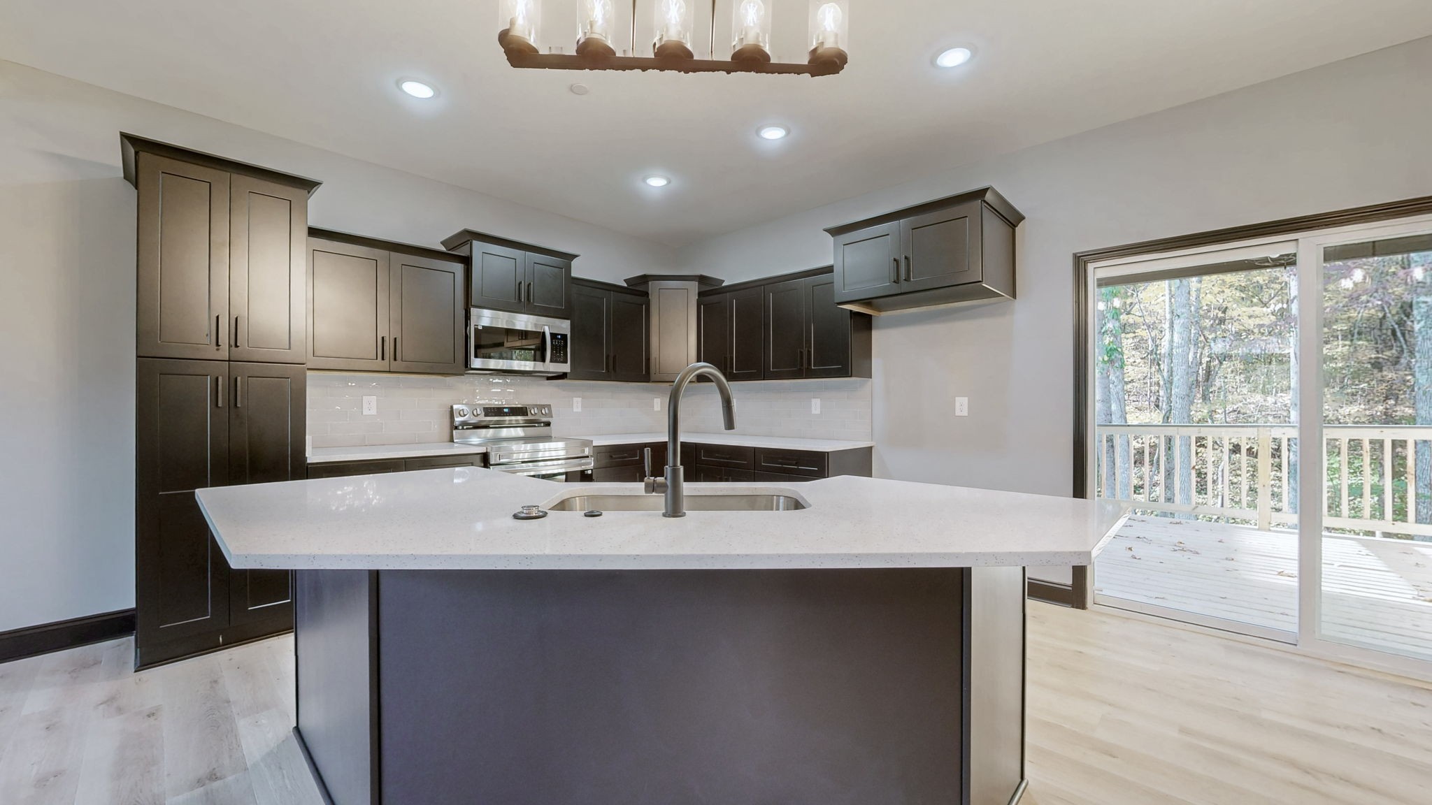 1236 Rooster Rdg Road Joelton, TN 37080 - Photo 2 of 19 a kitchen with kitchen island granite countertop a sink refrigerator and microwave