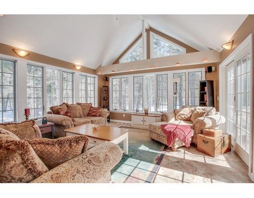 22 Battle Flagg Road Bedford, MA 01730 - Photo 11 of 30 a living room with furniture and large windows