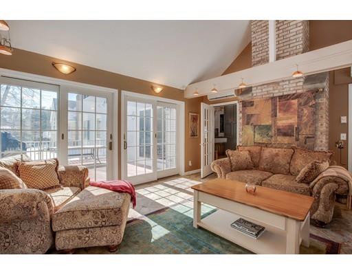 22 Battle Flagg Road Bedford, MA 01730 - Photo 12 of 30 a living room with furniture and a floor to ceiling window