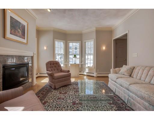22 Battle Flagg Road Bedford, MA 01730 - Photo 15 of 30 a living room with furniture and a fireplace