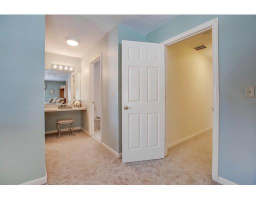 22 Battle Flagg Road Bedford, MA 01730 - Photo 19 of 30 a bathroom with a sink a toilet and a mirror