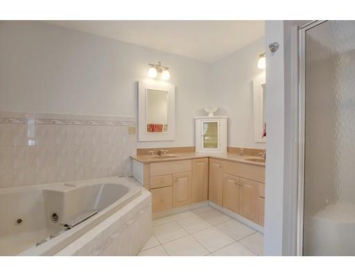 22 Battle Flagg Road Bedford, MA 01730 - Photo 20 of 30 a bathroom with a tub sink and mirror