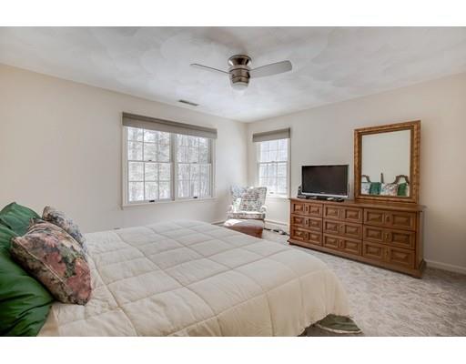 22 Battle Flagg Road Bedford, MA 01730 - Photo 23 of 30 a bedroom with a bed and a flat screen tv