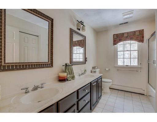 22 Battle Flagg Road Bedford, MA 01730 - Photo 25 of 30 a bathroom with a sink and a mirror