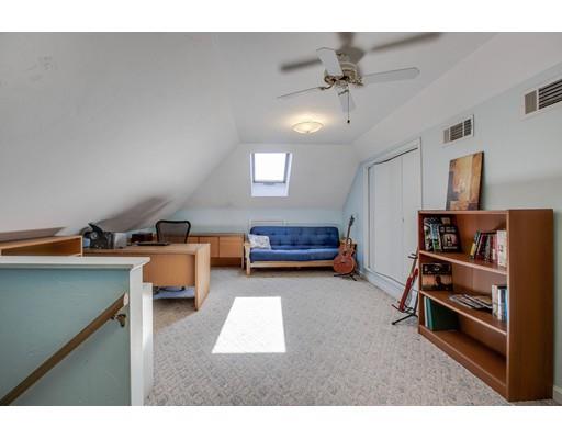 22 Battle Flagg Road Bedford, MA 01730 - Photo 26 of 30 a living room with furniture and a chandelier