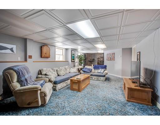 22 Battle Flagg Road Bedford, MA 01730 - Photo 27 of 30 a living room with furniture and a flat screen tv