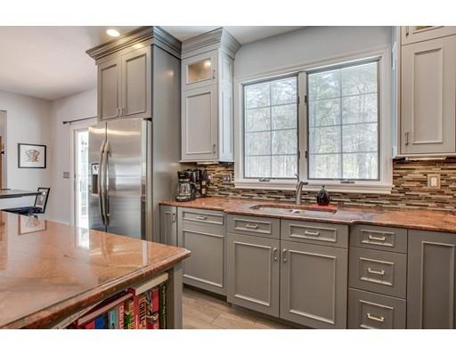 22 Battle Flagg Road Bedford, MA 01730 - Photo 4 of 30 a kitchen with stainless steel appliances granite countertop a sink a stove and refrigerator