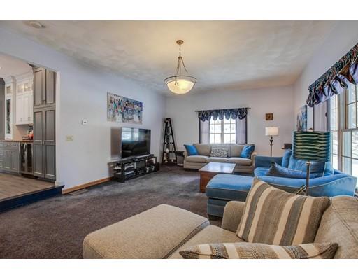 22 Battle Flagg Road Bedford, MA 01730 - Photo 8 of 30 a living room with furniture and a flat screen tv