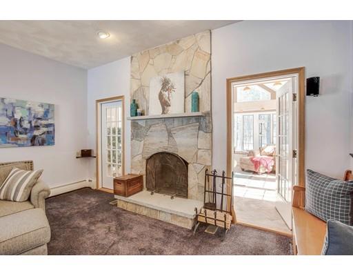 22 Battle Flagg Road Bedford, MA 01730 - Photo 10 of 30 a living room with furniture and a fireplace