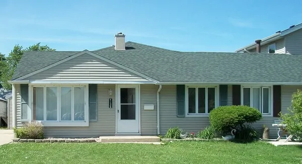 front view of a house with a yard