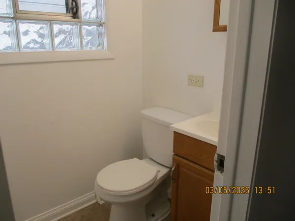 a bathroom with a toilet and a sink