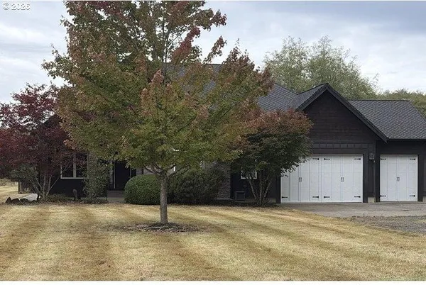a house with trees in the background