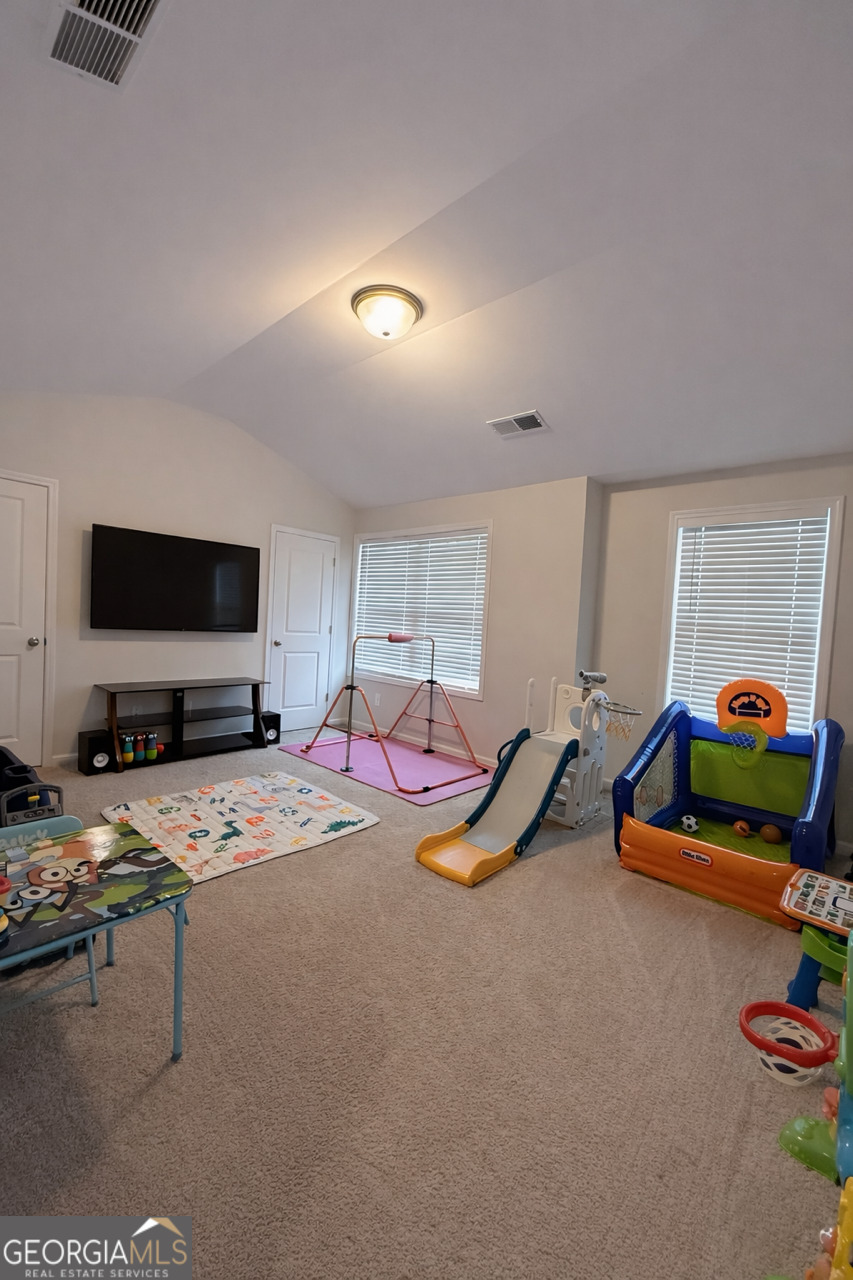 4355 Cornwall Drive Forsyth, GA 31029 - Photo 17 of 23 a bedroom with furniture and a flat screen tv