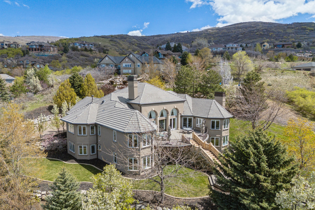 1714 Ridge Point Drive Bountiful, UT 84010 - Photo 4 of 132 Multi-level residence featuring a tiered tile roof, arched windows, and multiple outdoor deck spaces
