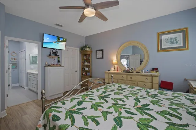 a bedroom with a bed and a dresser