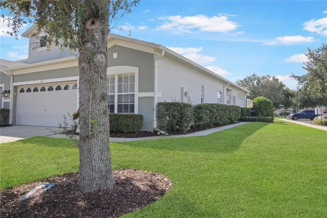 a front view of house with yard and outdoor seating