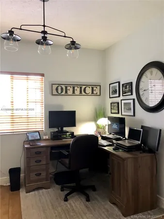 a view of a workspace with furniture