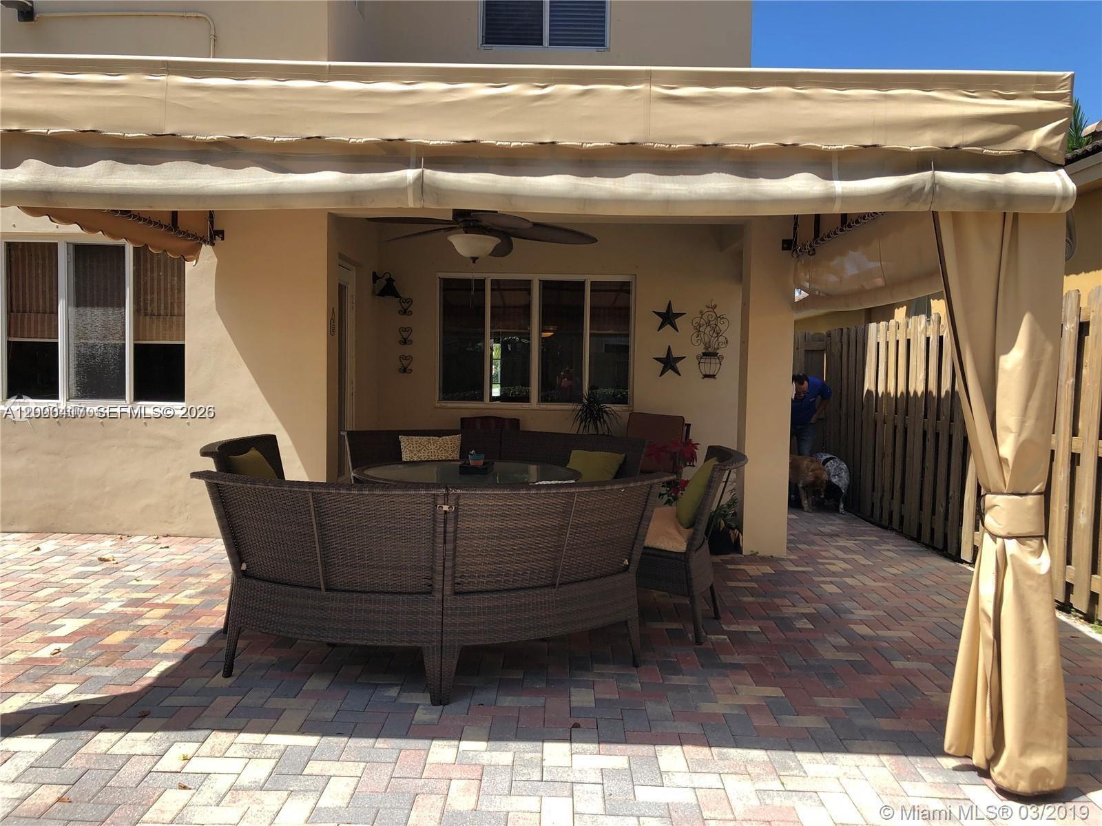 867 Southwest 155th Court, Unit 867 Miami, FL 33194 - Photo 21 of 25 a view of house with outdoor space and seating space