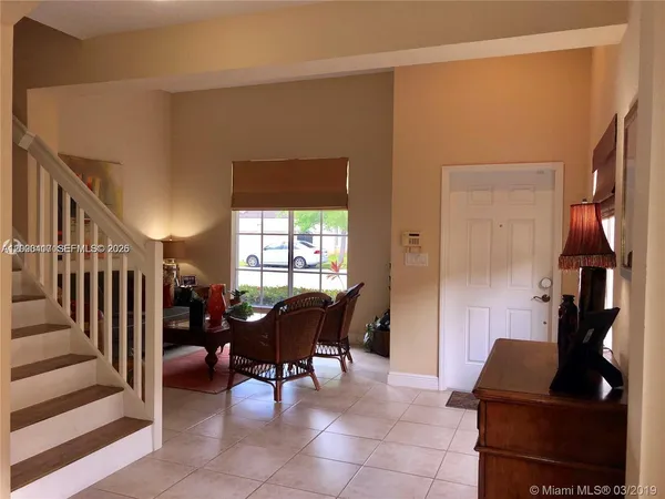 a living room with furniture and a window