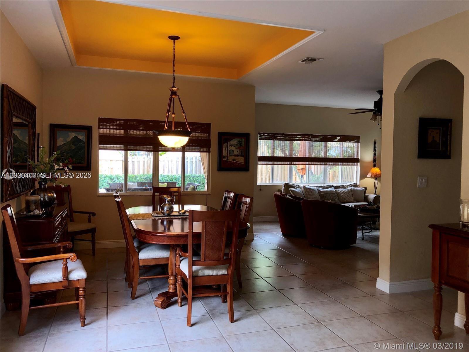 867 Southwest 155th Court, Unit 867 Miami, FL 33194 - Photo 9 of 25 a dining room with furniture and window