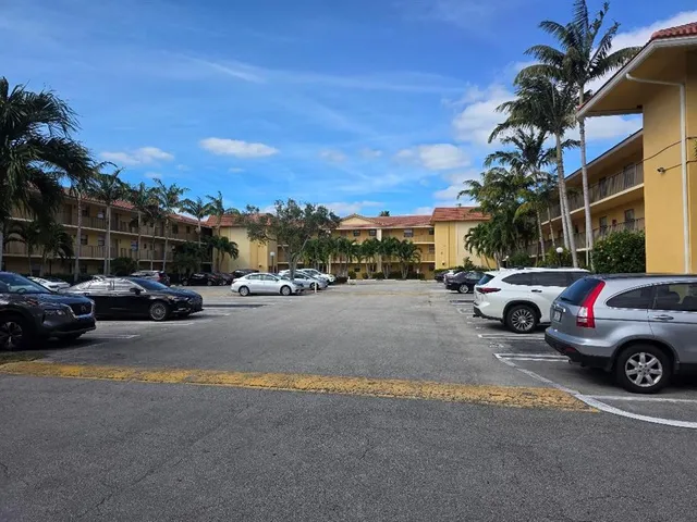 a view of street with parked cars