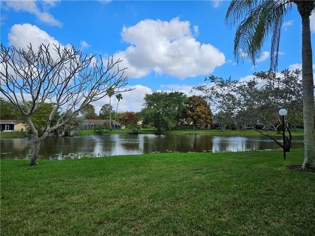a view of lake with green space
