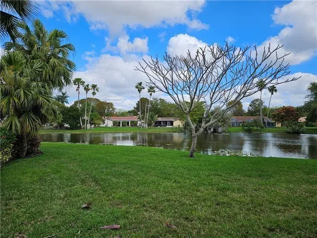 a view of lake with a building in the background