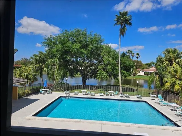 a view of swimming pool from a balcony