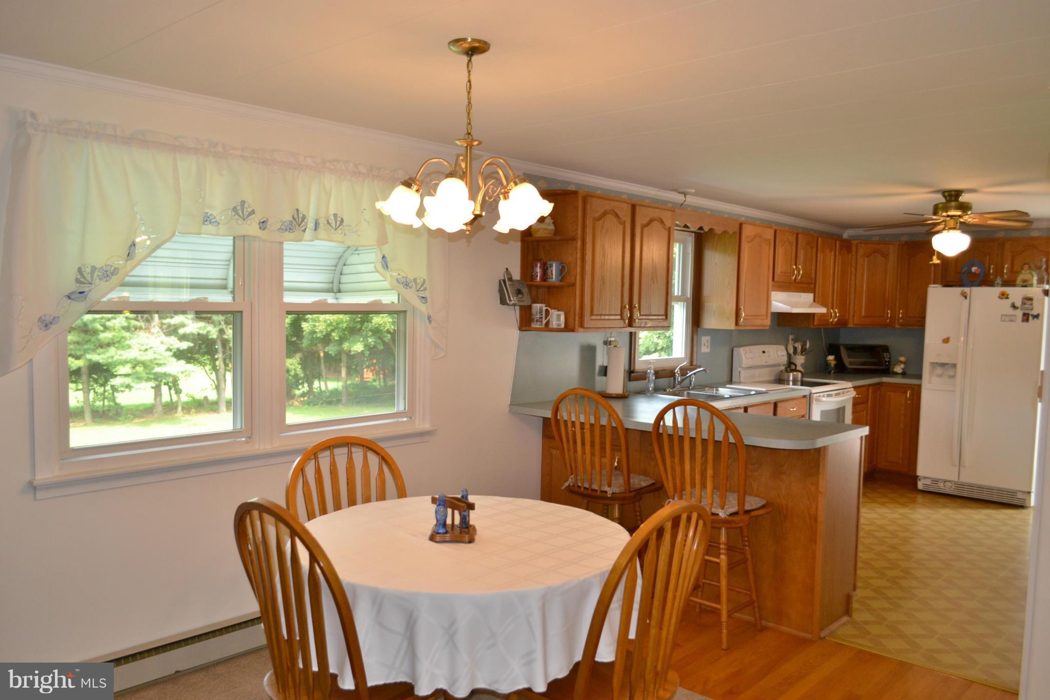 3424 Warehime Road Manchester, MD 21102 - Photo 8 of 26 a view of a dining room with furniture window and outside view