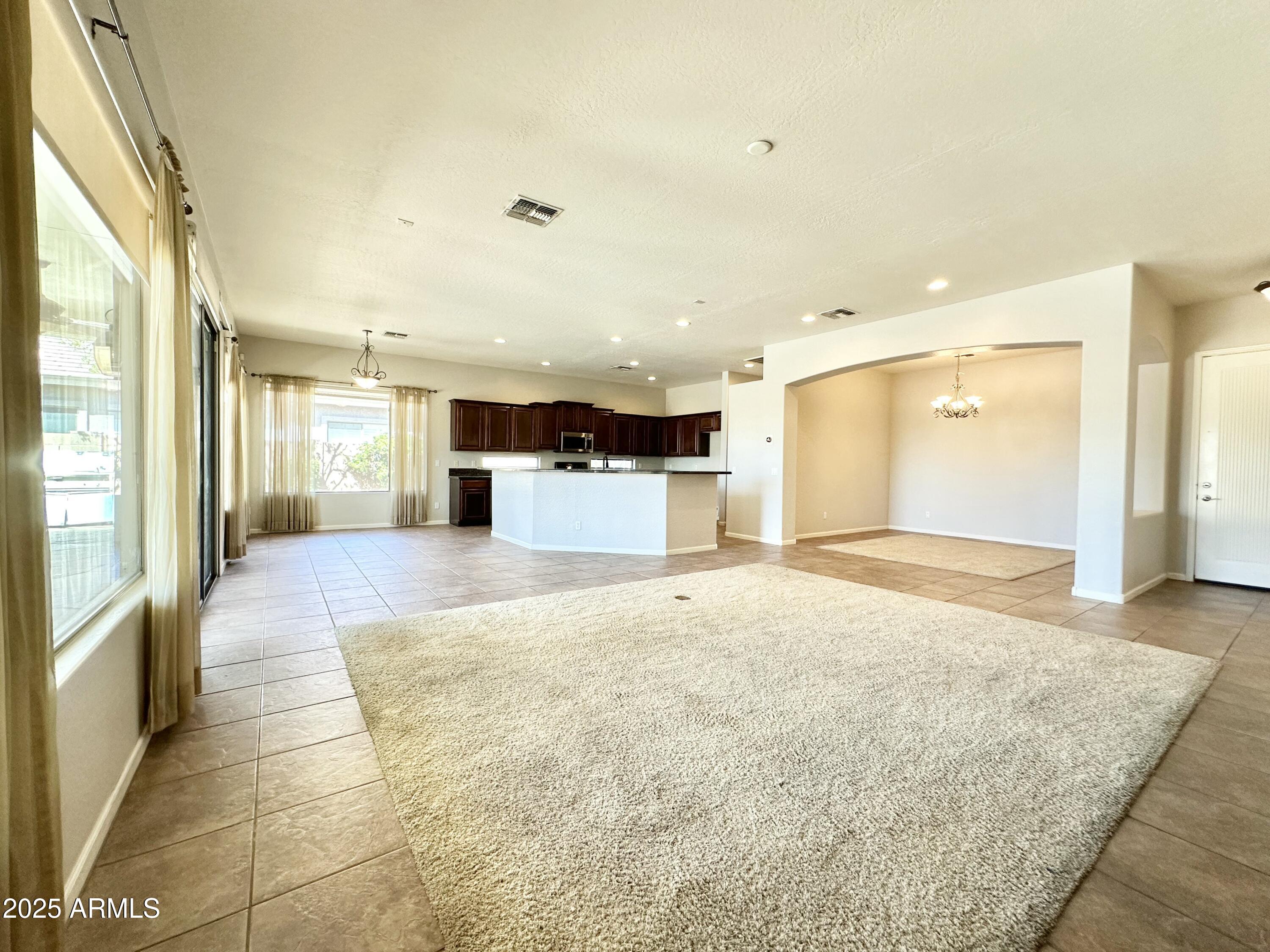 6562 South Crestview Drive Gilbert, AZ 85298 - Photo 12 of 23 a spacious bathroom with a large mirror vanity and shower