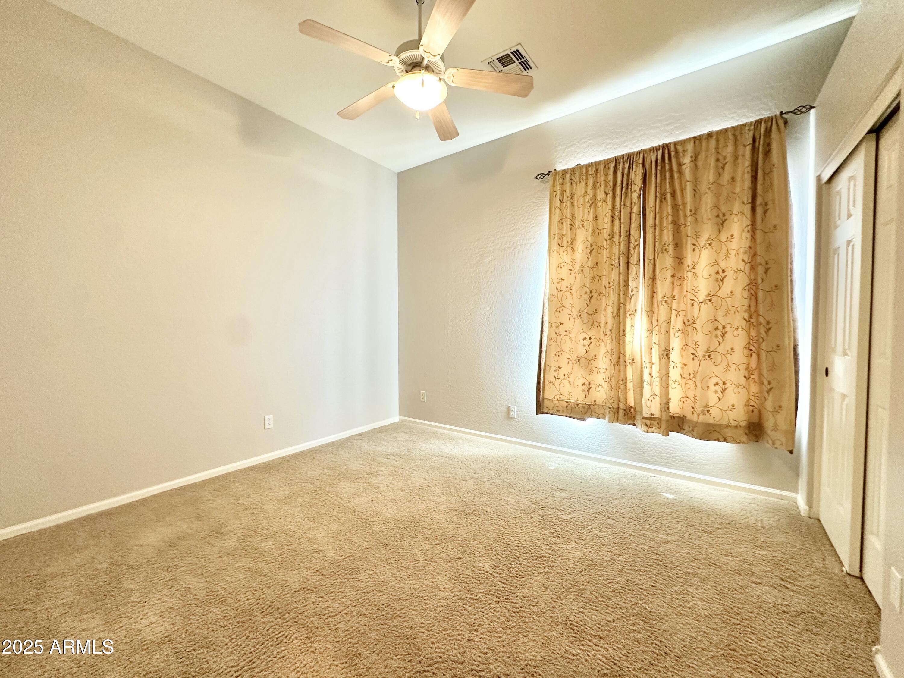 6562 South Crestview Drive Gilbert, AZ 85298 - Photo 17 of 23 a view of an empty room with a window