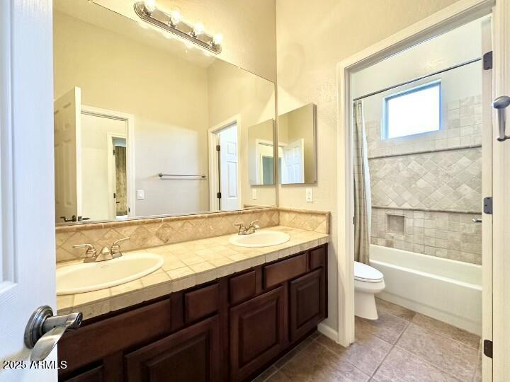 6562 South Crestview Drive Gilbert, AZ 85298 - Photo 18 of 23 a bathroom with a granite countertop sink a toilet and shower