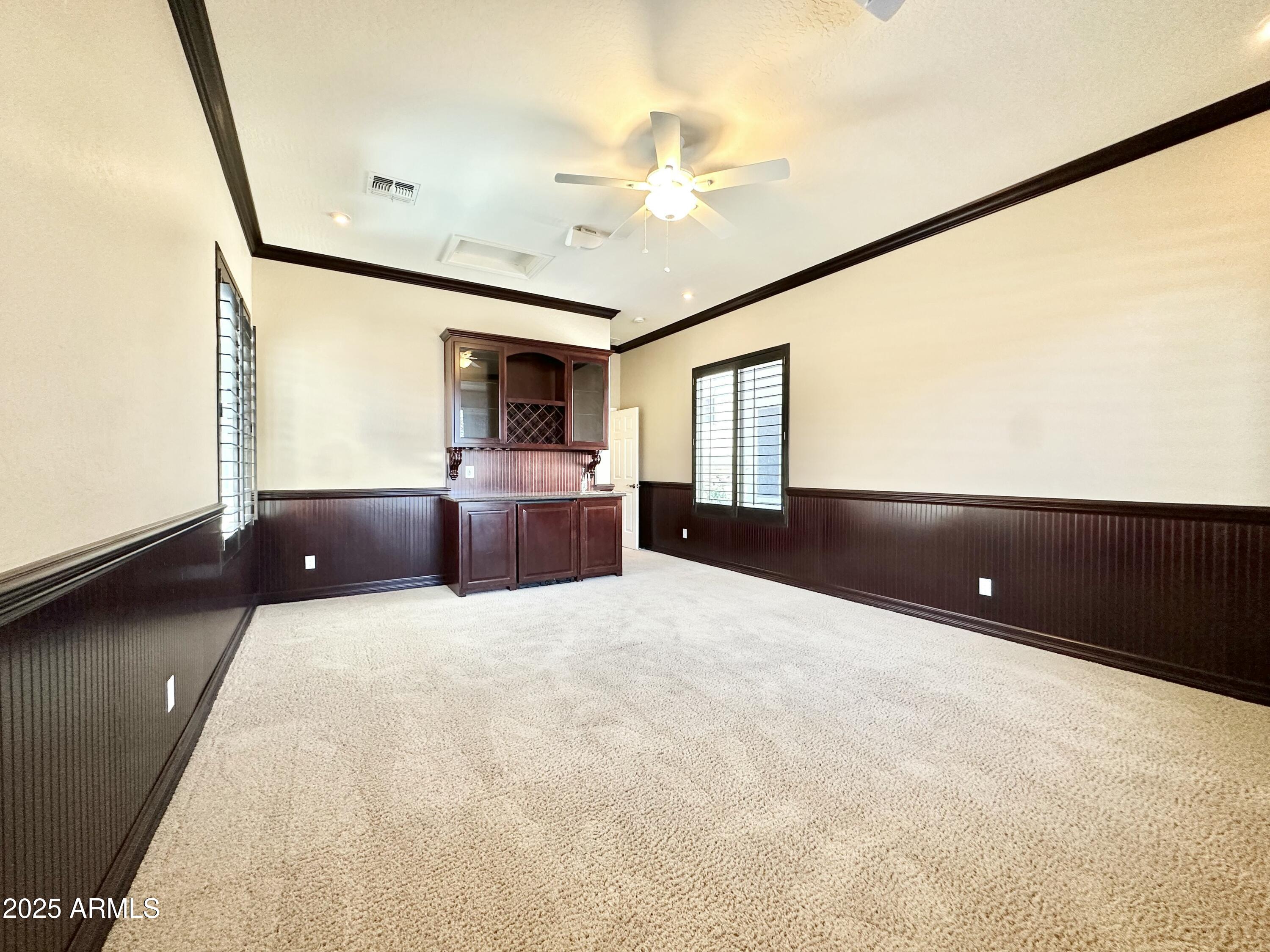 6562 South Crestview Drive Gilbert, AZ 85298 - Photo 20 of 23 a living room with furniture and a flat screen tv