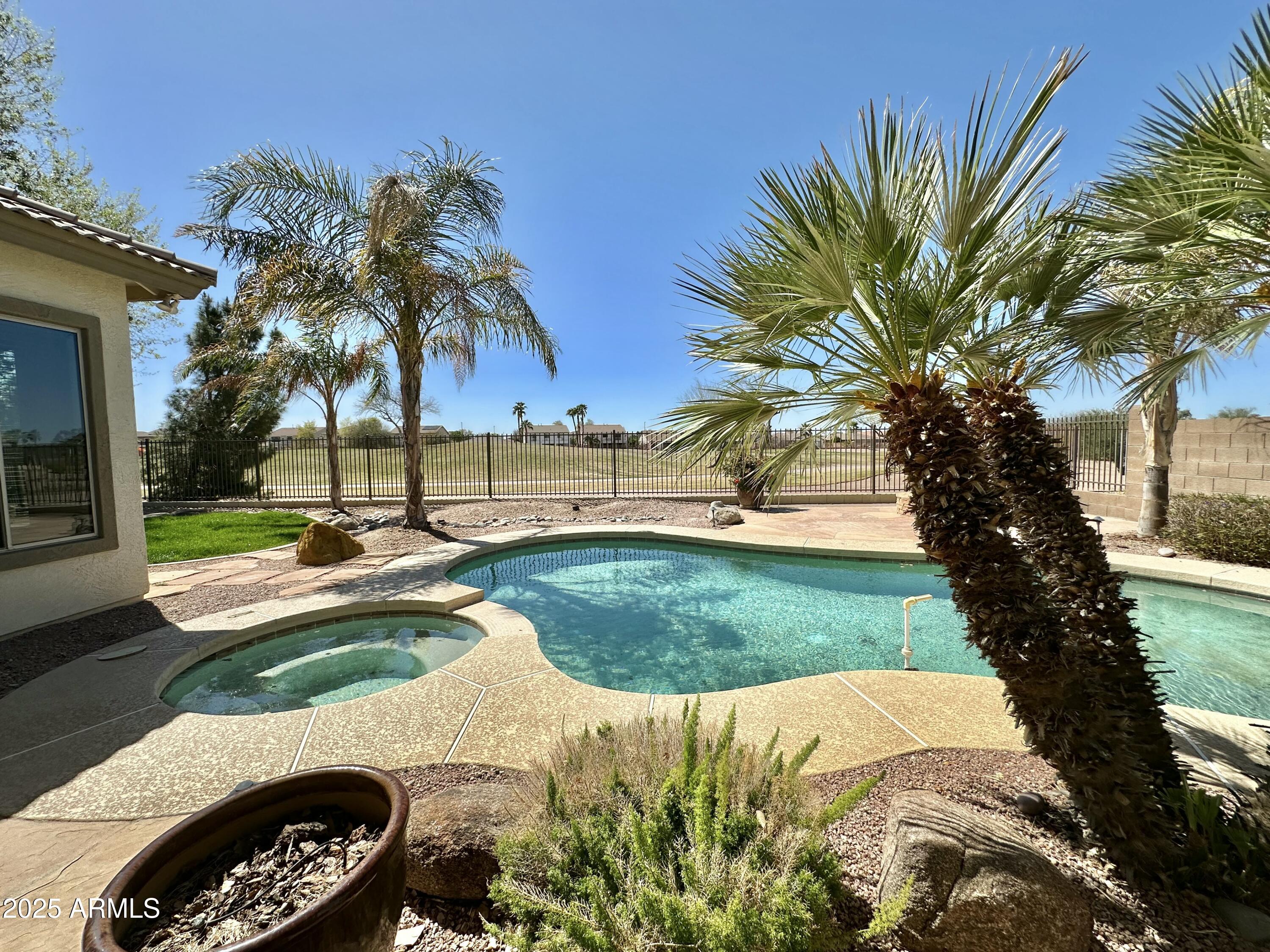 6562 South Crestview Drive Gilbert, AZ 85298 - Photo 2 of 23 a view of a park with palm trees