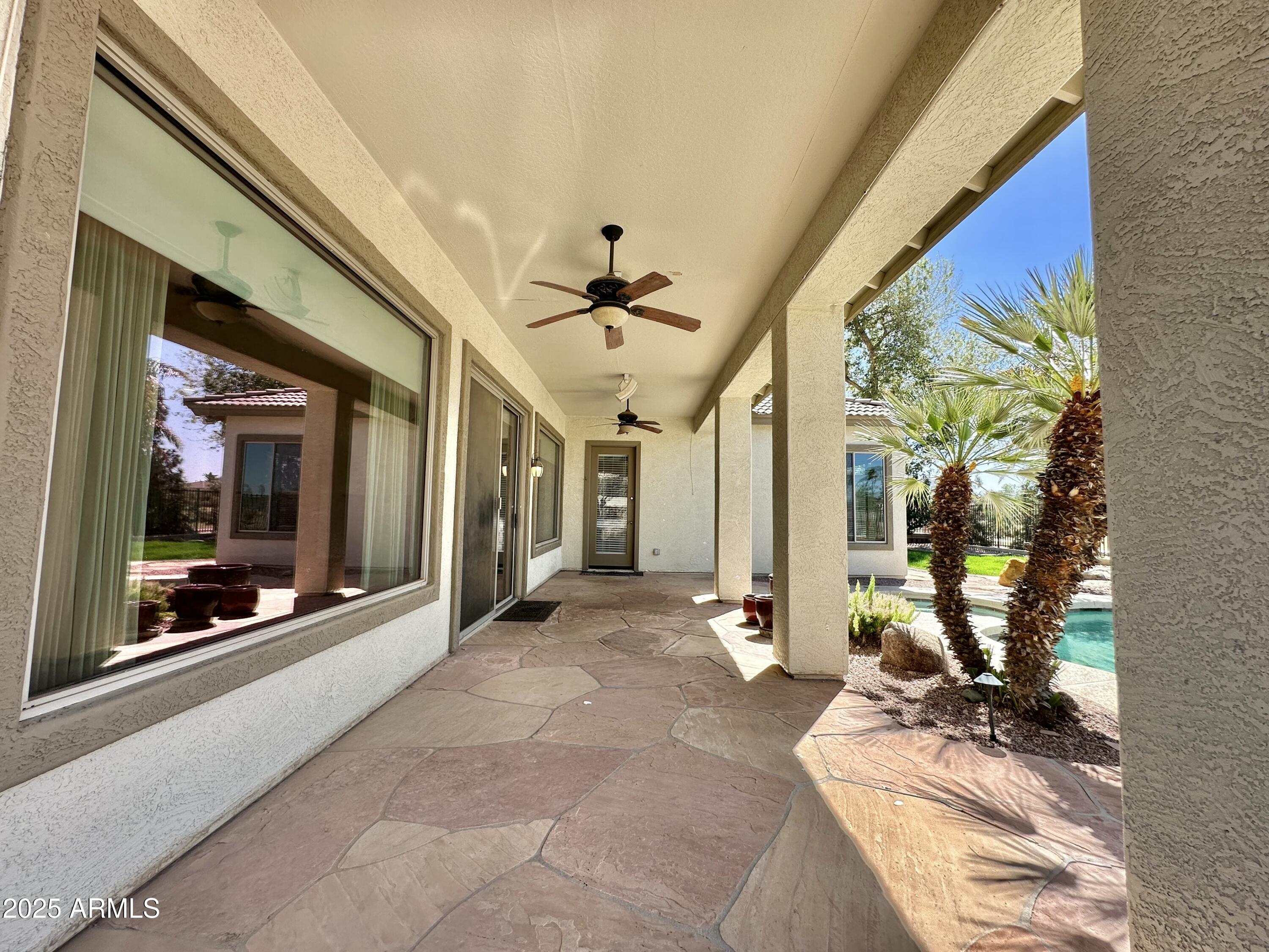 6562 South Crestview Drive Gilbert, AZ 85298 - Photo 21 of 23 a view of a hallway with wooden floor and a potted plant