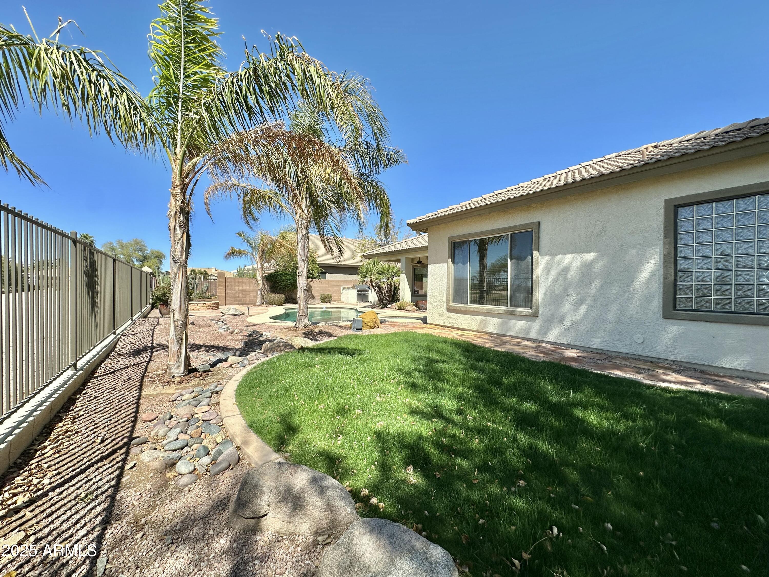 6562 South Crestview Drive Gilbert, AZ 85298 - Photo 4 of 23 a view of a house with backyard porch and sitting area