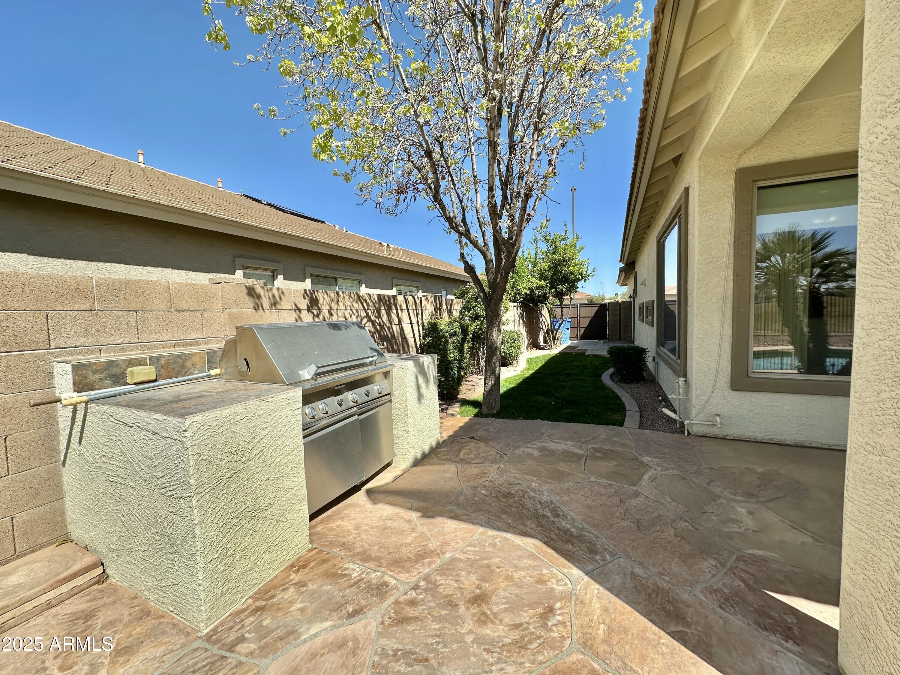 6562 South Crestview Drive Gilbert, AZ 85298 - Photo 5 of 23 a view of a backyard of a house with a garage