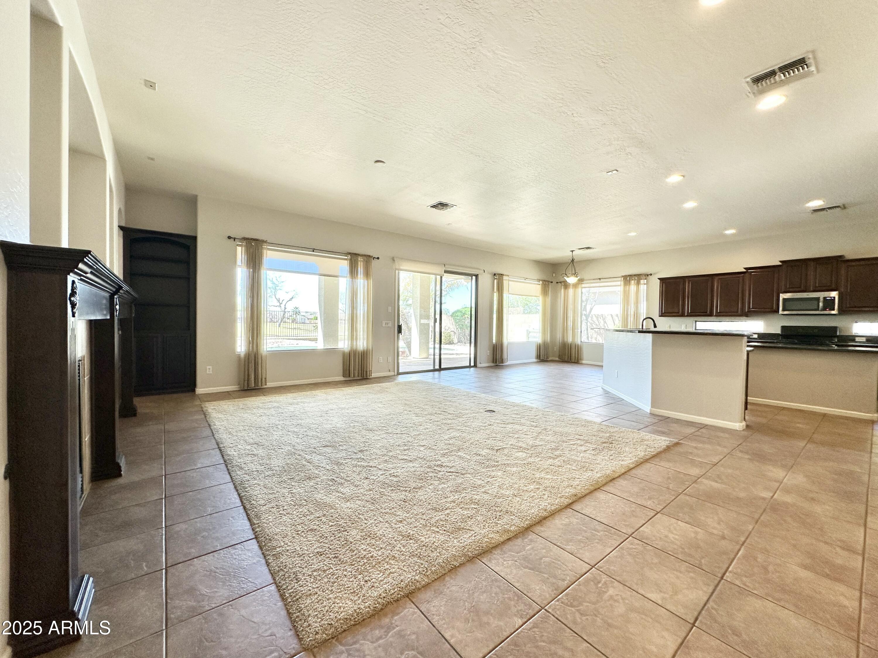 6562 South Crestview Drive Gilbert, AZ 85298 - Photo 6 of 23 a view of kitchen with refrigerator stove and cabinets