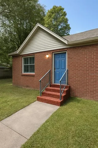 a front view of a house with a yard