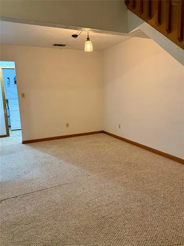 a view of an empty room with windows