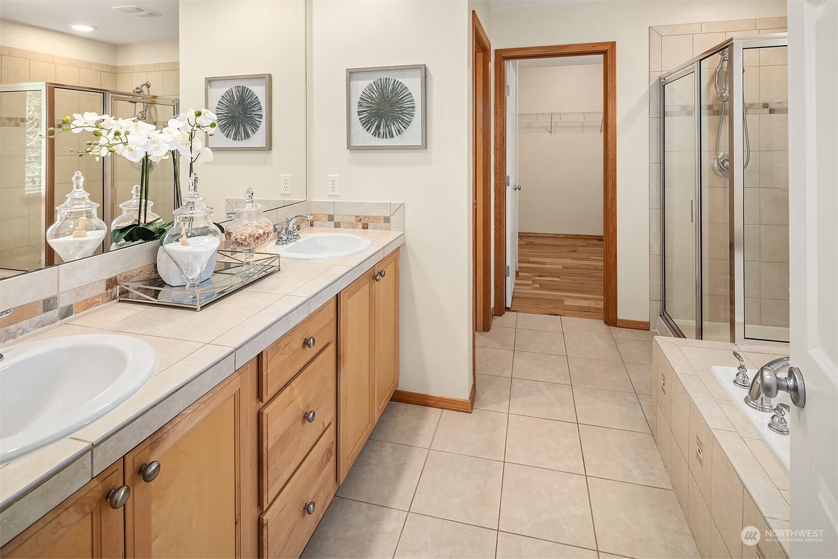 20012 79th Avenue Northeast Kenmore, WA 98028 - Photo 22 of 35 a spacious bathroom with a double vanity sink a mirror and a shower