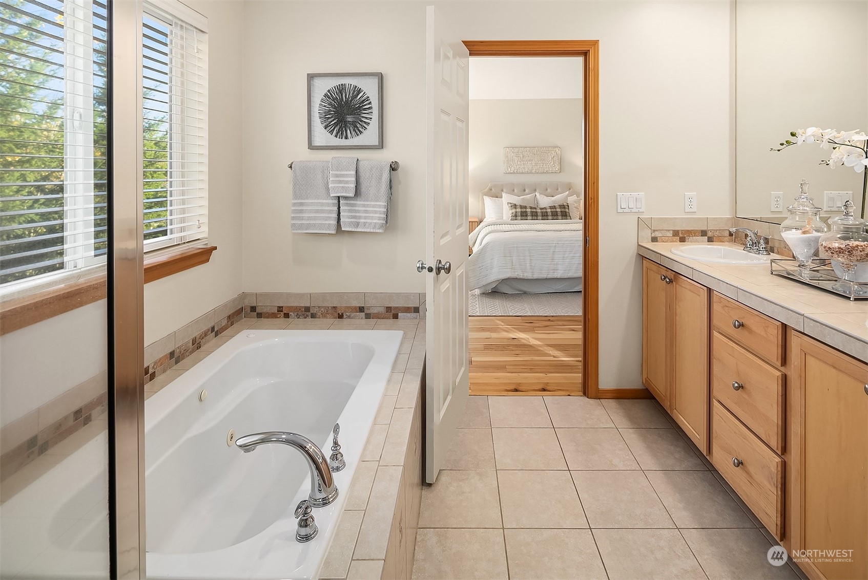 20012 79th Avenue Northeast Kenmore, WA 98028 - Photo 23 of 35 a bathroom with a tub sink and mirror