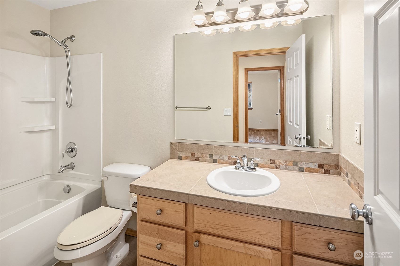 20012 79th Avenue Northeast Kenmore, WA 98028 - Photo 26 of 35 a bathroom with a sink a toilet and shower