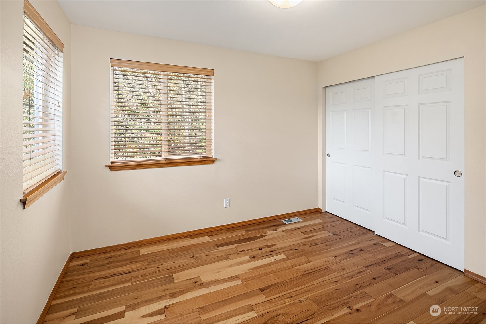 20012 79th Avenue Northeast Kenmore, WA 98028 - Photo 27 of 35 a view of an empty room with wooden floor and a window