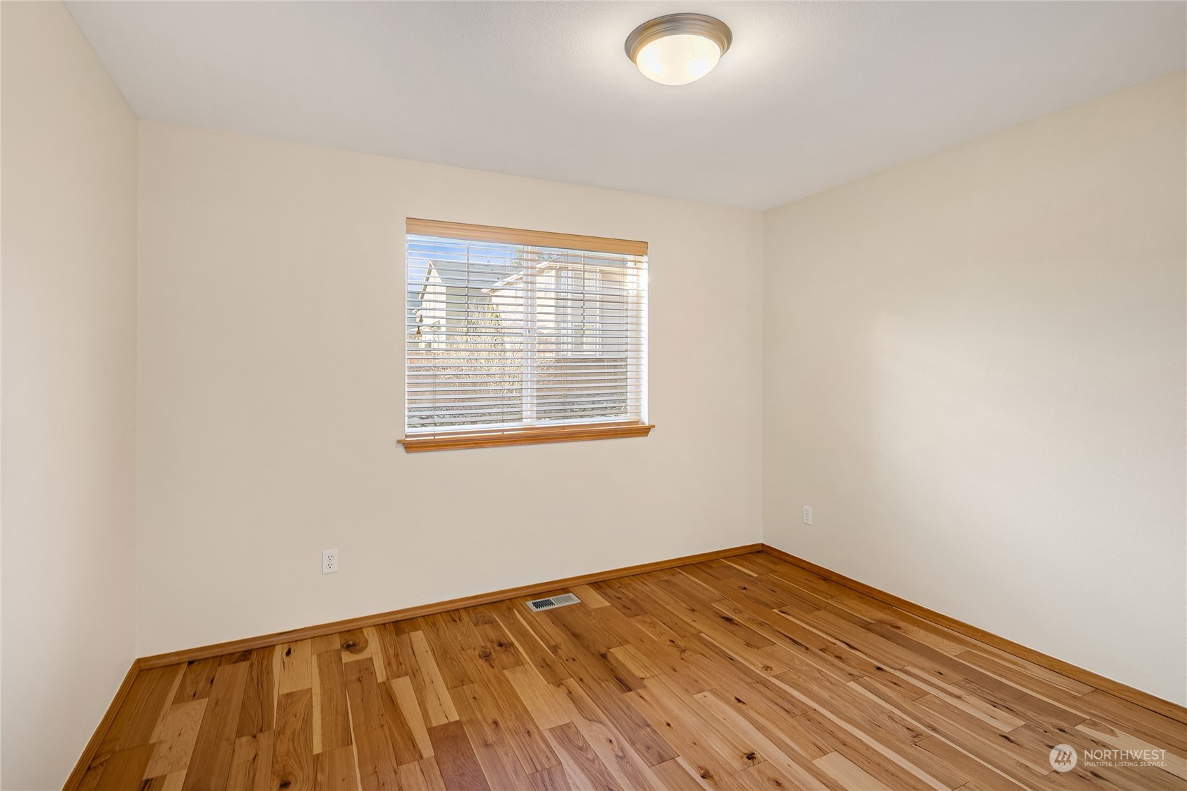 20012 79th Avenue Northeast Kenmore, WA 98028 - Photo 28 of 35 a view of a room with wooden floor and white walls